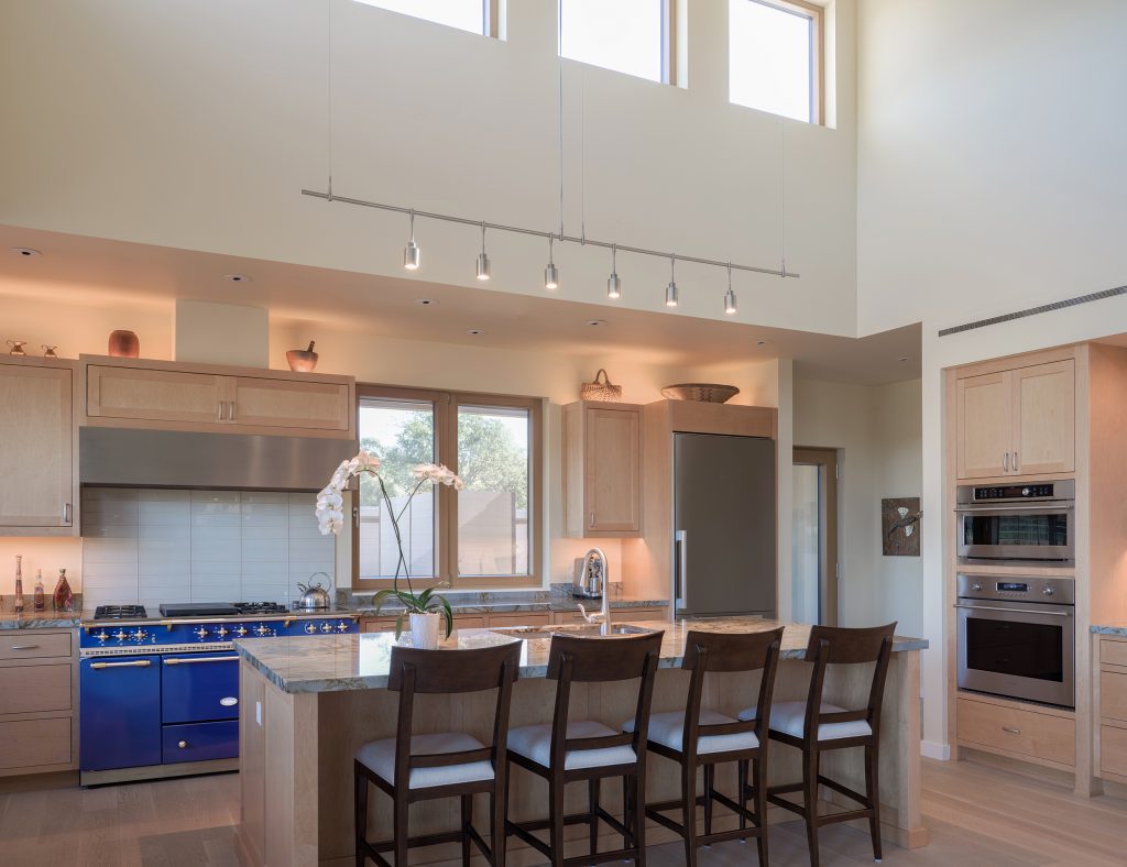 open kitchen space with tall ceilings
