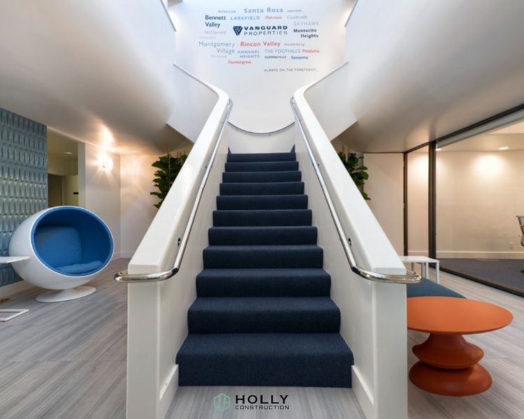 white modern staircase in the center of a chic office space