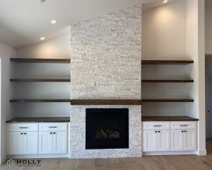 white brick fireplace with dark wood mantle