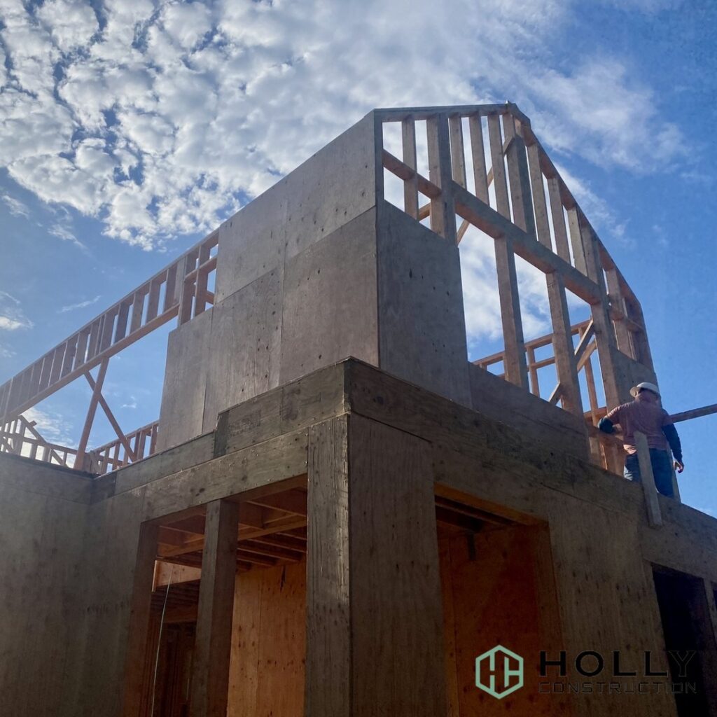 House Frame Being Built With Blue Skies in the Background