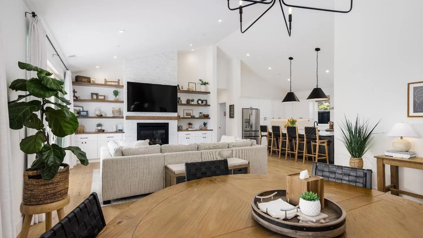 The interior of a well-designed contemporary home, including modern light fixtures and built-in shelving.