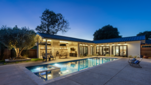 A gorgeous luxury custom home with a functional outdoor space for entertaining guests.